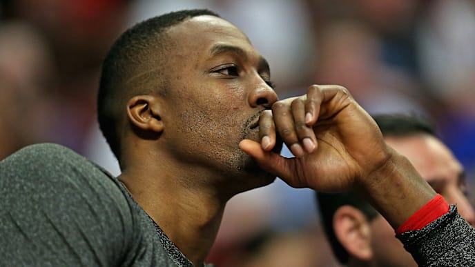 CHICAGO, IL - MARCH 13: Dwight Howard#12 of the Houston Rockets watches the end of the fourth quarter against the Chicago Bulls from the bench at the United Center on March 13, 2014 in Chicago, Illinois. The Bulls defeated the Rockets 111-87. NOTE TO USER: User expressly acknowledges and agrees that, by downloading and or using this photograph, User is consenting to the terms and conditions of the Getty Images License Agreement. (Photo by Jonathan Daniel/Getty Images) CHICAGO, IL - MARCH 13: Dwight Howard#12 of the Houston Rockets watches the end of the fourth quarter against the Chicago Bulls from the bench at the United Center on March 13, 2014 in Chicago, Illinois. The Bulls defeated the Rockets 111-87. NOTE TO USER: User expressly acknowledges and agrees that, by downloading and or using this photograph, User is consenting to the terms and conditions of the Getty Images License Agreement. (Photo by Jonathan Daniel/Getty Images)