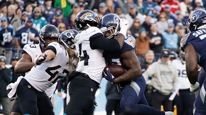 NASHVILLE, TENNESSEE - NOVEMBER 24: Dawuane Smoot #94 of the Jacksonville Jaguars stands up running back Derrick Henry #22 of the Tennessee Titans on a short yardage play during the first half at Nissan Stadium on November 24, 2019 in Nashville, Tennessee. (Photo by Frederick Breedon/Getty Images) NASHVILLE, TENNESSEE - NOVEMBER 24: Dawuane Smoot #94 of the Jacksonville Jaguars stands up running back Derrick Henry #22 of the Tennessee Titans on a short yardage play during the first half at Nissan Stadium on November 24, 2019 in Nashville, Tennessee. (Photo by Frederick Breedon/Getty Images)