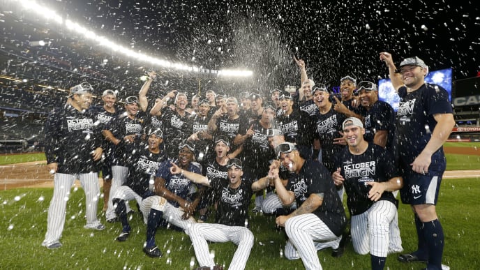 NEW YORK, NEW YORK - SEPTEMBER 19: The New York Yankees celebrate after they clinched the American League East Division with a 9-1 win over the Los Angeles Angels at Yankee Stadium on September 19, 2019 in Bronx borough of New York City. (Photo by Elsa/Getty Images) NEW YORK, NEW YORK - SEPTEMBER 19: The New York Yankees celebrate after they clinched the American League East Division with a 9-1 win over the Los Angeles Angels at Yankee Stadium on September 19, 2019 in Bronx borough of New York City. (Photo by Elsa/Getty Images)