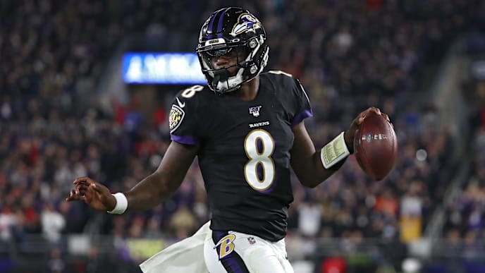 BALTIMORE, MARYLAND - NOVEMBER 03: Quarterback Lamar Jackson #8 of the Baltimore Ravens scores a first quarter touchdown against the New England Patriots at M&T Bank Stadium on November 3, 2019 in Baltimore, Maryland. (Photo by Todd Olszewski/Getty Images) BALTIMORE, MARYLAND - NOVEMBER 03: Quarterback Lamar Jackson #8 of the Baltimore Ravens scores a first quarter touchdown against the New England Patriots at M&T Bank Stadium on November 3, 2019 in Baltimore, Maryland. (Photo by Todd Olszewski/Getty Images)