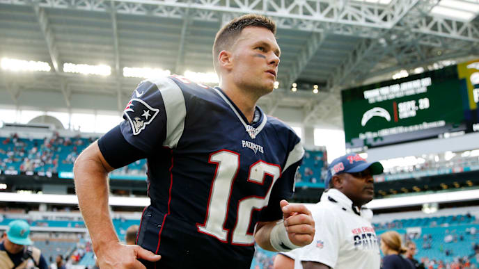 MIAMI, FLORIDA - SEPTEMBER 15: Tom Brady #12 of the New England Patriots runs off the field after defeating the Miami Dolphins 43-0 at Hard Rock Stadium on September 15, 2019 in Miami, Florida. (Photo by Michael Reaves/Getty Images) MIAMI, FLORIDA - SEPTEMBER 15: Tom Brady #12 of the New England Patriots runs off the field after defeating the Miami Dolphins 43-0 at Hard Rock Stadium on September 15, 2019 in Miami, Florida. (Photo by Michael Reaves/Getty Images)