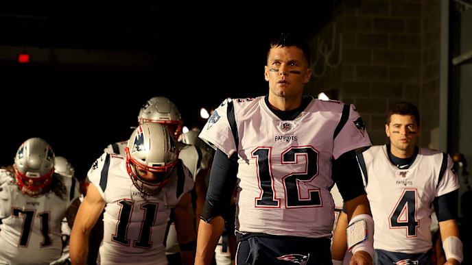 EAST RUTHERFORD, NEW JERSEY - OCTOBER 21: Quarterback Tom Brady #12 of the New England Patriots leads his team onto the field before the game against the New York Jets at MetLife Stadium on October 21, 2019 in East Rutherford, New Jersey. (Photo by Al Bello/Getty Images) EAST RUTHERFORD, NEW JERSEY - OCTOBER 21: Quarterback Tom Brady #12 of the New England Patriots leads his team onto the field before the game against the New York Jets at MetLife Stadium on October 21, 2019 in East Rutherford, New Jersey. (Photo by Al Bello/Getty Images)