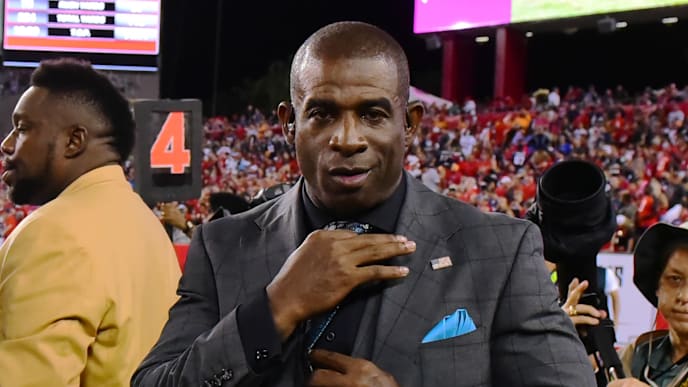 TAMPA, FL - OCTOBER 5: Deion Sanders fixes his tie on the sidelines during an NFL football game against the Tampa Bay Buccaneers and the New England Patriots on October 5, 2017 at Raymond James Stadium in Tampa, Florida. (Photo by Julio Aguilar/Getty Images) TAMPA, FL - OCTOBER 5: Deion Sanders fixes his tie on the sidelines during an NFL football game against the Tampa Bay Buccaneers and the New England Patriots on October 5, 2017 at Raymond James Stadium in Tampa, Florida. (Photo by Julio Aguilar/Getty Images)