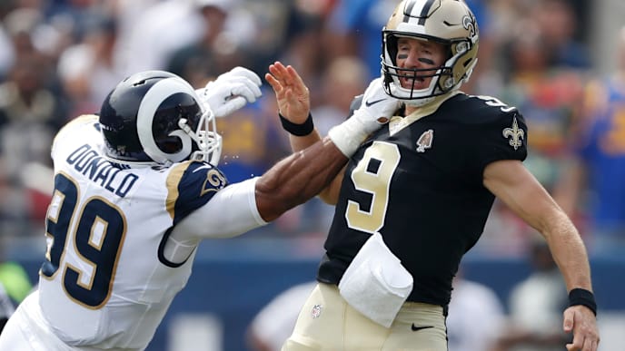 LOS ANGELES, CALIFORNIA - SEPTEMBER 15: Drew Brees #9 of the New Orleans Saints injures his throwing hand as he is hit by Aaron Donald #99 of the Los Angeles Rams during the first quarter in the gameat Los Angeles Memorial Coliseum on September 15, 2019 in Los Angeles, California. (Photo by Sean M. Haffey/Getty Images) LOS ANGELES, CALIFORNIA - SEPTEMBER 15: Drew Brees #9 of the New Orleans Saints injures his throwing hand as he is hit by Aaron Donald #99 of the Los Angeles Rams during the first quarter in the gameat Los Angeles Memorial Coliseum on September 15, 2019 in Los Angeles, California. (Photo by Sean M. Haffey/Getty Images)