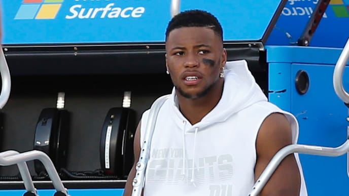 TAMPA, FLORIDA - SEPTEMBER 22: Running back Saquon Barkley #26 of the New York Giants sits on the bench with crutches and a boot after injuring his ankle in the first half during the game against the Tampa Bay Buccaneers at Raymond James Stadium on September 22, 2019 in Tampa, Florida. (Photo by Mike Zarrilli/Getty Images) TAMPA, FLORIDA - SEPTEMBER 22: Running back Saquon Barkley #26 of the New York Giants sits on the bench with crutches and a boot after injuring his ankle in the first half during the game against the Tampa Bay Buccaneers at Raymond James Stadium on September 22, 2019 in Tampa, Florida. (Photo by Mike Zarrilli/Getty Images)