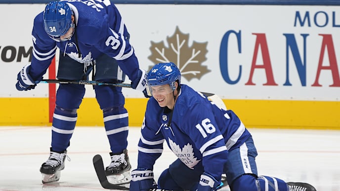 TORONTO, ON - OCTOBER 6: Mitchell Marner #16 and Auston Matthews #34 of the Toronto Maple Leafs share a light moment during warm-up prior to playing against the Ottawa Senators in an NHL game at Scotiabank Arena on October 6, 2018 in Toronto, Ontario, Canada. The Senators defeated the Maple Leafs 5-3.(Photo by Claus Andersen/Getty Images) TORONTO, ON - OCTOBER 6: Mitchell Marner #16 and Auston Matthews #34 of the Toronto Maple Leafs share a light moment during warm-up prior to playing against the Ottawa Senators in an NHL game at Scotiabank Arena on October 6, 2018 in Toronto, Ontario, Canada. The Senators defeated the Maple Leafs 5-3.(Photo by Claus Andersen/Getty Images)
