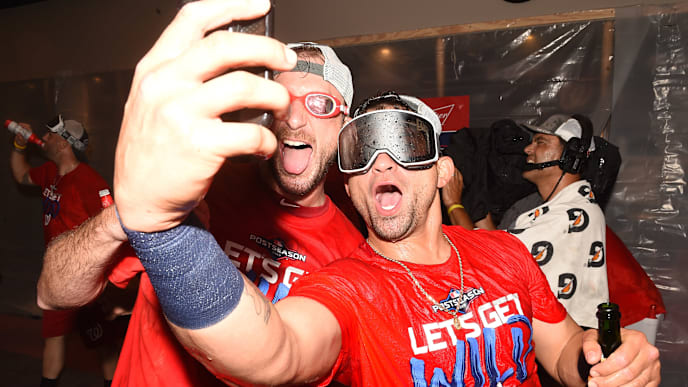 WASHINGTON, DC - SEPTEMBER 24: Max Scherzer #35 and Gerardo Parra #88 of the Washington Nationals celebrate clinching a spot in the playoffs after game two of a doubleheader baseball game against the Philadelphia Phillies at Nationals Park on September 24, 2019 in Washington, DC. (Photo by Mitchell Layton/Getty Images) WASHINGTON, DC - SEPTEMBER 24: Max Scherzer #35 and Gerardo Parra #88 of the Washington Nationals celebrate clinching a spot in the playoffs after game two of a doubleheader baseball game against the Philadelphia Phillies at Nationals Park on September 24, 2019 in Washington, DC. (Photo by Mitchell Layton/Getty Images)