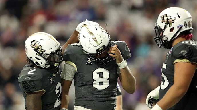 GLENDALE, ARIZONA - JANUARY 01: Running back Otis Anderson #2 hugs teammate quarterback Darriel Mack Jr. #8 of the UCF Knights during the fourth quarter of the PlayStation Fiesta Bowl between LSU and Central Florida at State Farm Stadium on January 01, 2019 in Glendale, Arizona. (Photo by Christian Petersen/Getty Images) GLENDALE, ARIZONA - JANUARY 01: Running back Otis Anderson #2 hugs teammate quarterback Darriel Mack Jr. #8 of the UCF Knights during the fourth quarter of the PlayStation Fiesta Bowl between LSU and Central Florida at State Farm Stadium on January 01, 2019 in Glendale, Arizona. (Photo by Christian Petersen/Getty Images)