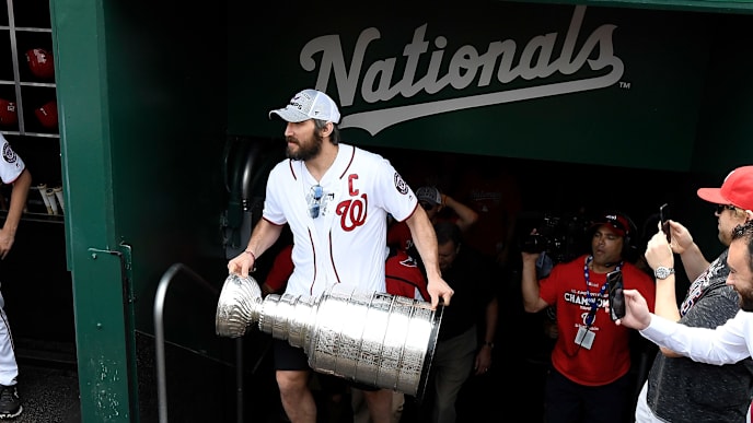WASHINGTON, DC - JUNE 09: Alex Ovechkin of the Washington Capitals carries the Stanley Cup onto the field before the game between the Washington Nationals and the San Francisco Giants at Nationals Park on June 9, 2018 in Washington, DC. (Photo by G Fiume/Getty Images) WASHINGTON, DC - JUNE 09: Alex Ovechkin of the Washington Capitals carries the Stanley Cup onto the field before the game between the Washington Nationals and the San Francisco Giants at Nationals Park on June 9, 2018 in Washington, DC. (Photo by G Fiume/Getty Images)