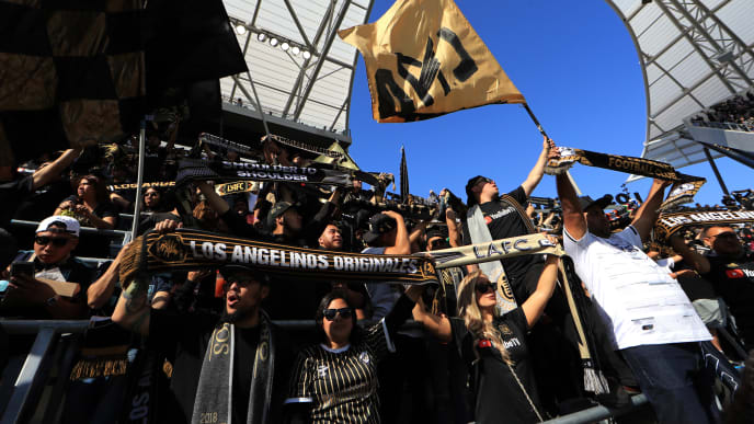 LOS ANGELES, CALIFORNIA - APRIL 21: Fans of Los Angeles FC cheer during the first half of a game between the Seattle Sounders and the Los Angeles FC at Banc of California Stadium on April 21, 2019 in Los Angeles, California. (Photo by Sean M. Haffey/Getty Images) LOS ANGELES, CALIFORNIA - APRIL 21: Fans of Los Angeles FC cheer during the first half of a game between the Seattle Sounders and the Los Angeles FC at Banc of California Stadium on April 21, 2019 in Los Angeles, California. (Photo by Sean M. Haffey/Getty Images)