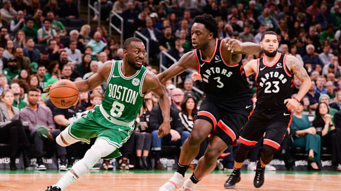 BOSTON, MA - OCTOBER 25: Kemba Walker #8 of the Boston Celtics drives past O.G. Anunoby #3 of the Toronto Raptors in the second half at TD Garden on October 25, 2019 in Boston, Massachusetts. NOTE TO USER: User expressly acknowledges and agrees that, by downloading and or using this photograph, User is consenting to the terms and conditions of the Getty Images License Agreement. (Photo by Kathryn Riley/Getty Images)