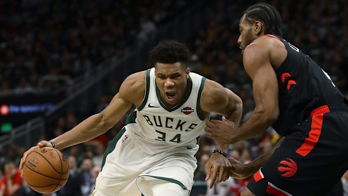 MILWAUKEE, WISCONSIN - MAY 17: Giannis Antetokounmpo #34 of the Milwaukee Bucks dribbles the ball while being guarded by Kawhi Leonard #2 of the Toronto Raptors in the fourth quarter during Game Two of the Eastern Conference Finals of the 2019 NBA Playoffs at the Fiserv Forum on May 17, 2019 in Milwaukee, Wisconsin. NOTE TO USER: User expressly acknowledges and agrees that, by downloading and or using this photograph, User is consenting to the terms and conditions of the Getty Images License Agreement. (Photo by Jonathan Daniel/Getty Images) MILWAUKEE, WISCONSIN - MAY 17: Giannis Antetokounmpo #34 of the Milwaukee Bucks dribbles the ball while being guarded by Kawhi Leonard #2 of the Toronto Raptors in the fourth quarter during Game Two of the Eastern Conference Finals of the 2019 NBA Playoffs at the Fiserv Forum on May 17, 2019 in Milwaukee, Wisconsin. NOTE TO USER: User expressly acknowledges and agrees that, by downloading and or using this photograph, User is consenting to the terms and conditions of the Getty Images License Agreement. (Photo by Jonathan Daniel/Getty Images)