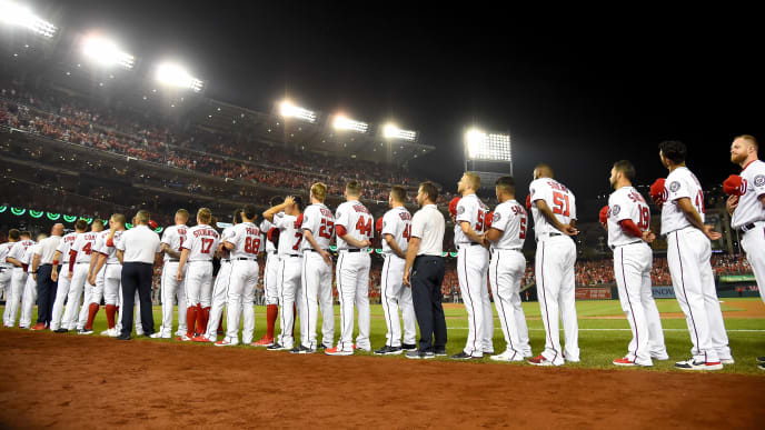 WASHINGTON, DC - OCTOBER 01: The Washington Nationals stand for the national anthem prior to the National League Wild Card game against the Milwaukee Brewers at Nationals Park on October 01, 2019 in Washington, DC. (Photo by Will Newton/Getty Images) WASHINGTON, DC - OCTOBER 01: The Washington Nationals stand for the national anthem prior to the National League Wild Card game against the Milwaukee Brewers at Nationals Park on October 01, 2019 in Washington, DC. (Photo by Will Newton/Getty Images)