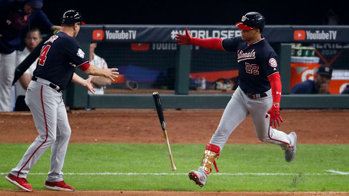 HOUSTON, TEXAS - OCTOBER 29: Juan Soto #22 of the Washington Nationals tosses the bat toward third base coach Bob Henley #14 after hitting a solo home run against the Houston Astros during the fifth inning in Game Six of the 2019 World Series at Minute Maid Park on October 29, 2019 in Houston, Texas. (Photo by Tim Warner/Getty Images) HOUSTON, TEXAS - OCTOBER 29: Juan Soto #22 of the Washington Nationals tosses the bat toward third base coach Bob Henley #14 after hitting a solo home run against the Houston Astros during the fifth inning in Game Six of the 2019 World Series at Minute Maid Park on October 29, 2019 in Houston, Texas. (Photo by Tim Warner/Getty Images)