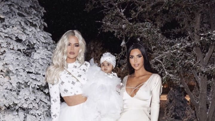 Khloé Kardashian, True Thompson, and Kim Kardashian at Christmas 2018