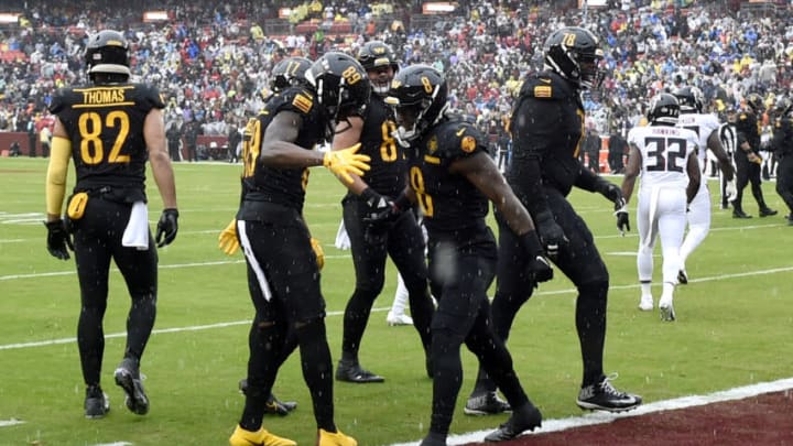 LANDOVER, MARYLAND - NOVEMBER 27: Brian Robinson Jr. #8 of the Washington Commanders celebrates a touchdown with teammates in the first quarter of a game against the Atlanta Falcons at FedExField on November 27, 2022 in Landover, Maryland. (Photo by Greg Fiume/Getty Images)