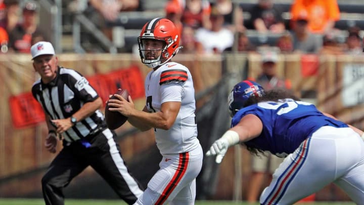 Cleveland Browns quarterback Kyle Lauletta (17) scrambles away from New York Giants defensive tackle David Moa (96) during the first half of an NFL preseason football game, Sunday, Aug. 22, 2021, in Cleveland, Ohio. [Jeff Lange/Beacon Journal]Brownsgiants 13