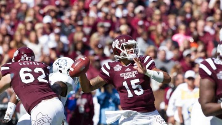 Oct 4, 2014; Starkville, MS, USA; Mississippi State Bulldogs quarterback Dak Prescott (15) throws the ball against the Texas A&M Aggies at Davis Wade Stadium. Mandatory Credit: Marvin Gentry-USA TODAY Sports