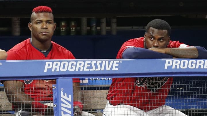 CLEVELAND, OH - AUGUST 01: Yasiel Puig #66 and Franmil Reyes #32 of the Cleveland Indians watch from the dugout in the eighth inning against the Houston Astros at Progressive Field on August 1, 2019 in Cleveland, Ohio. The Astros defeated the Indians 7-1. Puig and Reyes were playing in their first game with the Indians since being traded by the Cincinnati Reds and the San Diego Padres respectively. (Photo by David Maxwell/Getty Images)