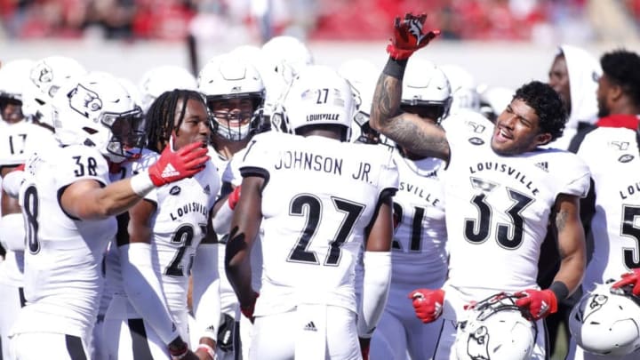 LOUISVILLE, KENTUCKY - OCTOBER 05: Anthony Johnson #27 and the Louisville football players celebrate an interception in the game against the Boston College Eagles at Cardinal Stadium on October 05, 2019 in Louisville, Kentucky. (Photo by Justin Casterline/Getty Images)