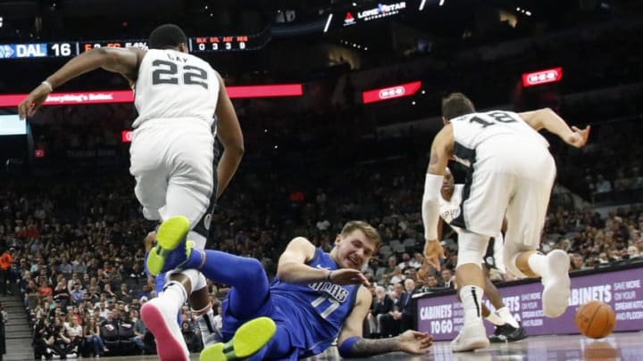 SAN ANTONIO,TX - OCTOBER 29: Luka Doncic #77 of the Dallas Mavericks hits the floor as the San Antonio Spurs try to push the ball downcourt at AT&T Center on October 29 , 2018 in San Antonio, Texas. NOTE TO USER: User expressly acknowledges and agrees that , by downloading and or using this photograph, User is consenting to the terms and conditions of the Getty Images License Agreement. (Photo by Ronald Cortes/Getty Images)