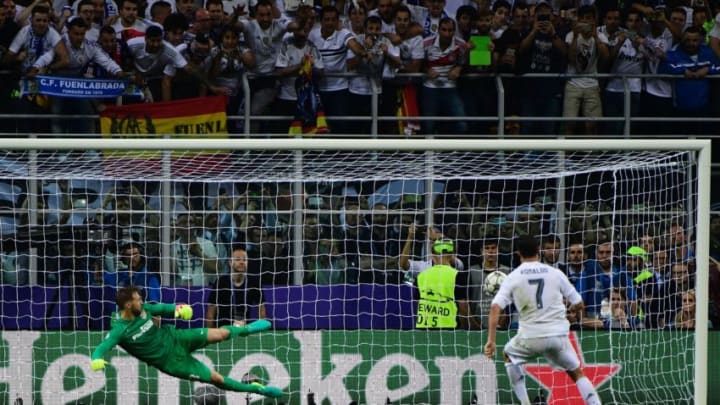 Real Madrid’s Portuguese forward Cristiano Ronaldo kicks to score during the penalty shoot-out in the UEFA Champions League final football match between Real Madrid and Atletico Madrid at San Siro Stadium in Milan, on May 28, 2016. / AFP / PIERRE-PHILIPPE MARCOU (Photo credit should read PIERRE-PHILIPPE MARCOU/AFP/Getty Images)