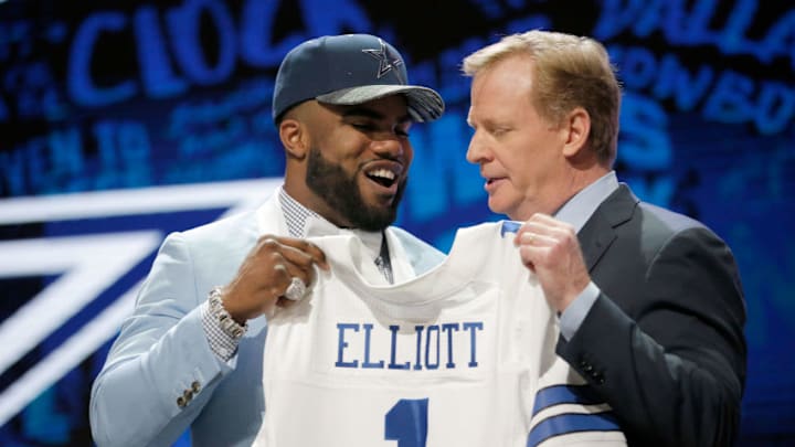 CHICAGO, IL - APRIL 28: (L-R) Ezekiel Elliott of Ohio State holds up a jersey with NFL Commissioner Roger Goodell after being picked