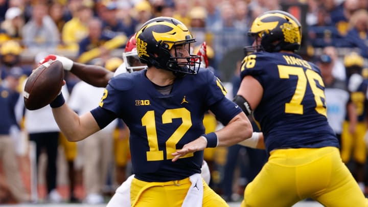 Sep 25, 2021; Ann Arbor, Michigan, USA; Michigan Wolverines quarterback Cade McNamara (12) passes against the Rutgers Scarlet Knights first half at Michigan Stadium. Mandatory Credit: Rick Osentoski-USA TODAY Sports