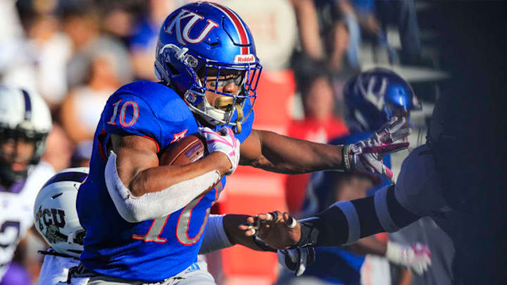 LAWRENCE, KS - OCTOBER 27: Khalil Herbert #10 of the Kansas Jayhawks runs the ball against the TCU Horned Frogs during the third quarter at Memorial Stadium on October 27, 2018 in Lawrence, Kansas. (Photo by Brian Davidson/Getty Images)