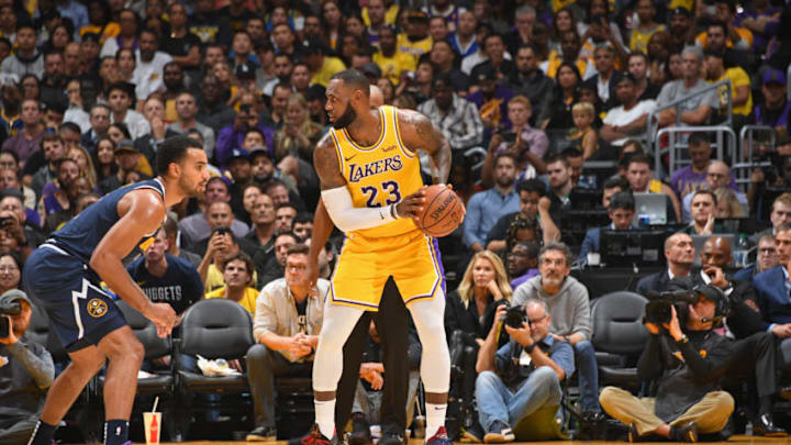 LOS ANGELES, CA - OCTOBER 25: NBA legend, Kobe Bryant looks on as LeBron James #23 of the Los Angeles Lakers dribbles the ball against the Denver Nuggets on October 25, 2018 at STAPLES Center in Los Angeles, California. NOTE TO USER: User expressly acknowledges and agrees that, by downloading and/or using this Photograph, user is consenting to the terms and conditions of the Getty Images License Agreement. Mandatory Copyright Notice: Copyright 2018 NBAE (Photo by Andrew D. Bernstein/NBAE via Getty Images)