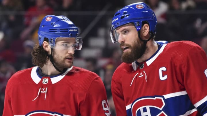 MONTREAL, QC - MARCH 12: Jonathan Drouin #92 and teammate Shea Weber #6 of the Montreal Canadiens talk it out against the Detroit Red Wings during the NHL game at the Bell Centre on March 12, 2019 in Montreal, Quebec, Canada. The Montreal Canadiens defeated the Detroit Red Wings 3-1. (Photo by Minas Panagiotakis/Getty Images)