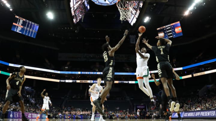 CHARLOTTE, NORTH CAROLINA - MARCH 12: Anthony Lawrence II #3 of the Miami (Fl) Hurricanes drives to the basket against teammates Jaylen Hoard #10 and Isaiah Mucius #1 of the Wake Forest Demon Deacons during their game in the first round of the 2019 Men's ACC Basketball Tournament at Spectrum Center on March 12, 2019 in Charlotte, North Carolina. (Photo by Streeter Lecka/Getty Images)