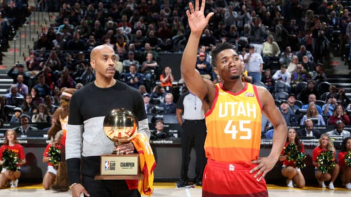 SALT LAKE CITY, UT – FEBRUARY 23: Darrell Griffith and Donovan Mitchell #45 of the Utah Jazz share his dunk contest trophy with the crowd at vivint.SmartHome Arena on February 23, 2018 in Salt Lake City, Utah. NOTE TO USER: User expressly acknowledges and agrees that, by downloading and or using this Photograph, User is consenting to the terms and conditions of the Getty Images License Agreement. Mandatory Copyright Notice: Copyright 2018 NBAE (Photo by Melissa Majchrzak/NBAE via Getty Images) SALT LAKE CITY, UT – FEBRUARY 23: on February 23, 2018 at vivint.SmartHome Arena in Salt Lake City, Utah. NOTE TO USER: User expressly acknowledges and agrees that, by downloading and or using this Photograph, User is consenting to the terms and conditions of the Getty Images License Agreement. Mandatory Copyright Notice: Copyright 2018 NBAE (Photo by Melissa Majchrzak/NBAE via Getty Images)