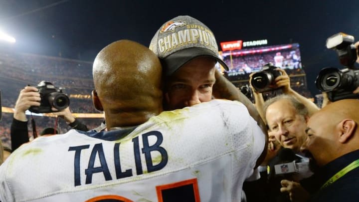 Feb 7, 2016; Santa Clara, CA, USA; Denver Broncos quarterback Peyton Manning (18) celebrates with cornerback Aqib Talib (21) after winning Super Bowl 50 against the Carolina Panthers at Levi