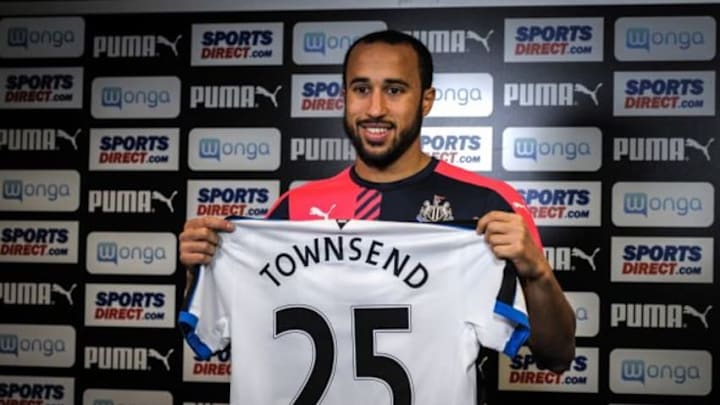NEWCASTLE UPON TYNE, ENGLAND - JANUARY 28: New Signing Andros Townsend holds up his named and numbered shirt in a press conference at The Newcastle United Training Centre on January 28, 2016, in Newcastle upon Tyne, England. (Photo by Serena Taylor/Newcastle United via Getty Images)