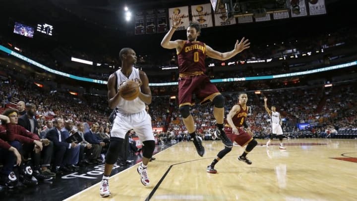 Dec 5, 2015; Miami, FL, USA; Miami Heat forward Chris Bosh (1) avoids Cleveland Cavaliers forward Kevin Love (0) during the second half at American Airlines Arena. The Heat won 99-84. Mandatory Credit: Steve Mitchell-USA TODAY Sports