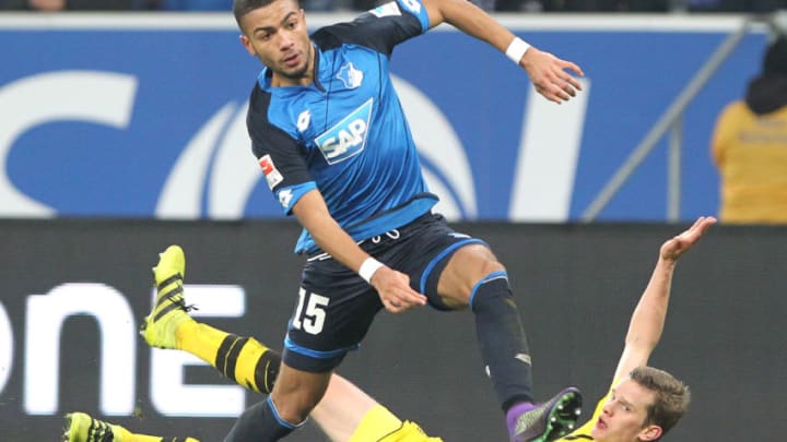 Hoffenheim's defender Jeremy Toljan (front) and Dortmund's US midfielder Christian Pulisic vie for the ball during the German first division Bundesliga football match between TSG Hoffenheim and BVB Borussia Dortmund at the Wirsol Rhein-Neckar-Arena in Sinsheim, southern Germany, on December 16, 2016. / AFP / Amelie QUERFURTH / RESTRICTIONS: DURING MATCH TIME: DFL RULES TO LIMIT THE ONLINE USAGE TO 15 PICTURES PER MATCH AND FORBID IMAGE SEQUENCES TO SIMULATE VIDEO. == RESTRICTED TO EDITORIAL USE == FOR FURTHER QUERIES PLEASE CONTACT DFL DIRECTLY AT 49 69 650050 (Photo credit should read AMELIE QUERFURTH/AFP/Getty Images)