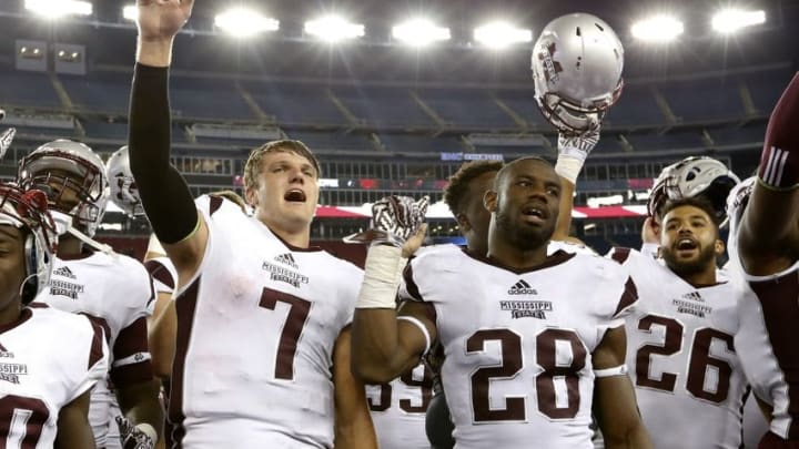Sep 24, 2016; Foxborough, MA, USA; Mississippi State Bulldogs quarterback Nick Fitzgerald (7) and line backer DeAndre Ward (28) celebrate after defeating the Massachusetts Minutemen 47-35 at Gillette Stadium. Credit: Greg M. Cooper-USA TODAY Sports