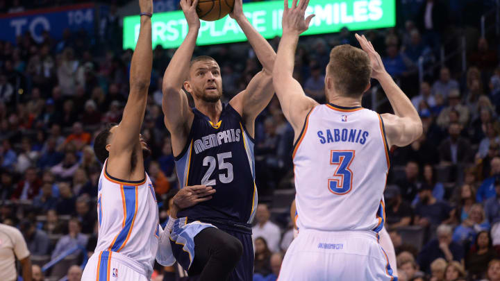 Feb 3, 2017; Oklahoma City, OK, USA; Memphis Grizzlies forward Chandler Parsons (25) prepares to shoot the ball between OKC Thunder forward Andre Roberson (21) and forward Domantas Sabonis (3) during the first quarter at Chesapeake Energy Arena. (Mandatory Credit: Mark D. Smith-USA TODAY Sports)