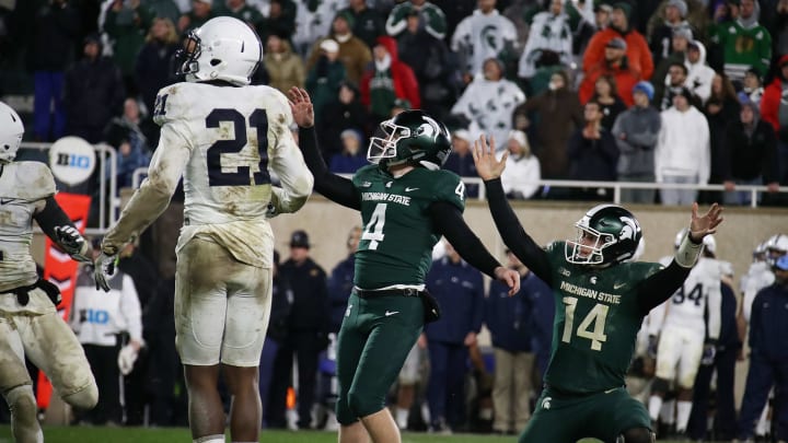 EAST LANSING, MI – NOVEMBER 04: Brian Lewerke #14 of the Michigan State Spartans celebrates a game winning field goal by Matt Coghlin #4 next to Amani Oruwariye #21 of the Penn State Nittany Lions as time expired for a 27-24 win at Spartan Stadium on November 4, 2017 in East Lansing, Michigan. (Photo by Gregory Shamus/Getty Images)