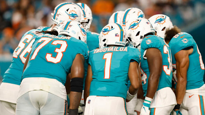 MIAMI GARDENS, FLORIDA - AUGUST 21: Tua Tagovailoa #1 of the Miami Dolphins talks to the team in the huddle against the Atlanta Falcons during a preseason game at Hard Rock Stadium on August 21, 2021 in Miami Gardens, Florida. (Photo by Michael Reaves/Getty Images)
