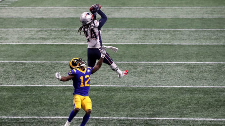 ATLANTA, GEORGIA - FEBRUARY 03: Stephon Gilmore #24 of the New England Patriots catches a fourth quarter interception on a pass intended for Brandin Cooks #12 of the Los Angeles Rams during Super Bowl LIII at Mercedes-Benz Stadium on February 03, 2019 in Atlanta, Georgia. (Photo by Streeter Lecka/Getty Images)