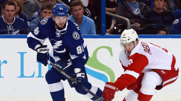 Apr 15, 2016; Tampa, FL, USA; Tampa Bay Lightning right wing Nikita Kucherov (86) passes the puck as Detroit Red Wings left wing Justin Abdelkader (8) defends during the third period of the game two of the first round of the 2016 Stanley Cup Playoffs at Amalie Arena. Tampa Bay Lightning defeated the Detroit Red Wings 5-2. Mandatory Credit: Kim Klement-USA TODAY Sports