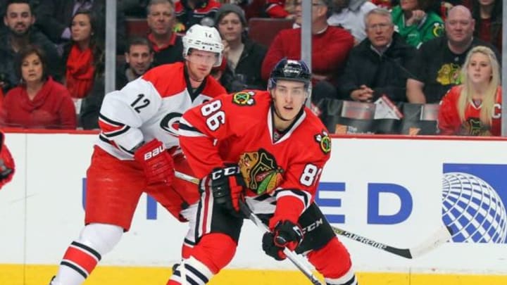 Mar 2, 2015; Chicago, IL, USA; Chicago Blackhawks left wing Teravainen (86) is pursued by Carolina Hurricanes center Eric Staal (12) during the first period at the United Center. Mandatory Credit: Dennis Wierzbicki-USA TODAY Sports