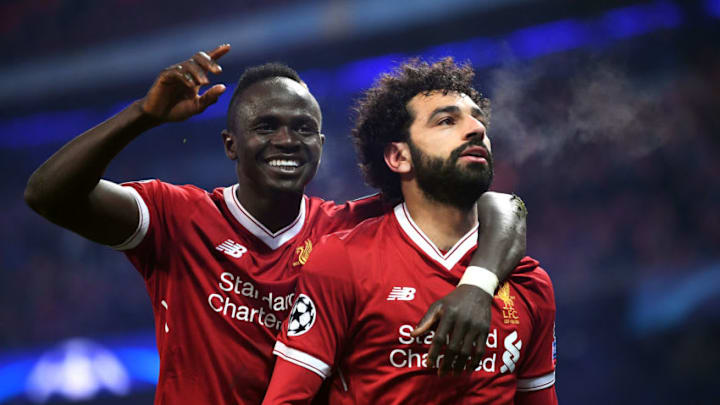 MANCHESTER, ENGLAND - APRIL 10: Mohamed Salah of Liverpool celebrates with teammate Sadio Mane after scoring his sides first goal during the UEFA Champions League Quarter Final Second Leg match between Manchester City and Liverpool at Etihad Stadium on April 10, 2018 in Manchester, England. (Photo by Laurence Griffiths/Getty Images,)