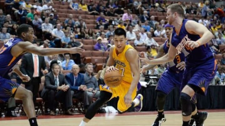 Oct 21, 2014; Anaheim, CA, USA; Los Angeles Lakers guard Jeremy Lin (17) drives against the Phoenix Suns defense during the fourth quarter at Honda Center. Mandatory Credit: Richard Mackson-USA TODAY Sports