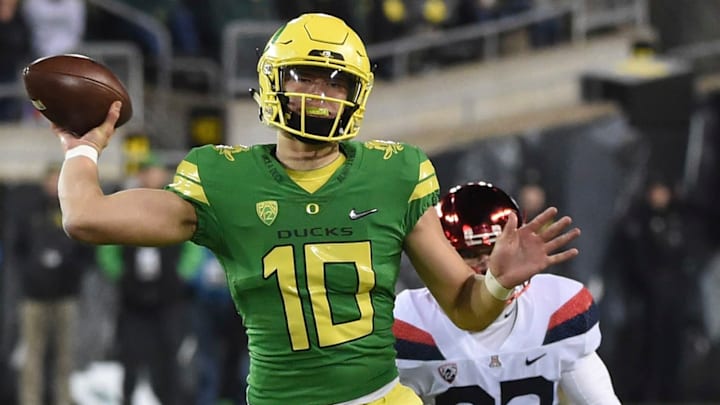 EUGENE, OR – NOVEMBER 18: Quarterback Justin Herbert #10 of the Oregon Ducks passes the ball as defensive end Jack Banda #92 of the Arizona Wildcats applies pressure during the second half of the game at Autzen Stadium on November 18, 2017 in Eugene, Oregon. The Ducks won the game 48-28. (Photo by Steve Dykes/Getty Images)