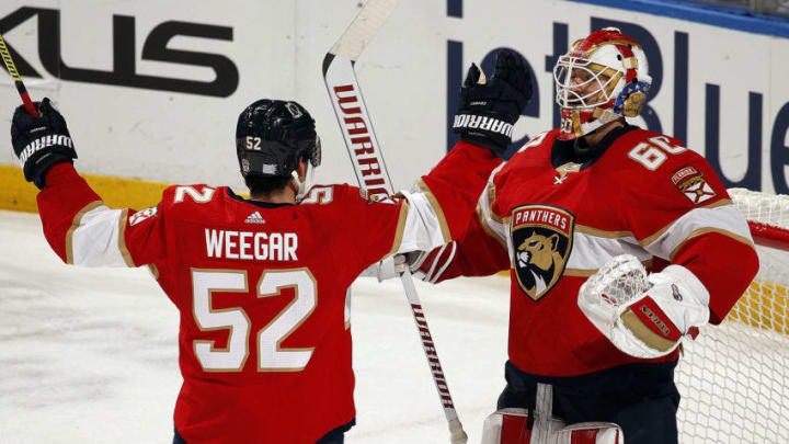 SUNRISE, FL - NOVEMBER 30: Goaltender Chris Driedger #60 of the Florida Panthers celebrates with teammate MacKenzie Weegar #52 his 3-0 shut out win against the Nashville Predators at the BB&T Center on November 30, 2019 in Sunrise, Florida. (Photo by Eliot J. Schechter/NHLI via Getty Images)