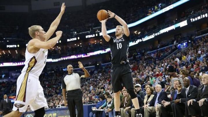 Feb 7, 2014; New Orleans, LA, USA; Minnesota Timberwolves small forward Chase Budinger (10) shoots the ball over New Orleans Pelicans center Greg Stiemsma (34) in the first half at the Smoothie King Center. Mandatory Credit: Crystal LoGiudice-USA TODAY Sports