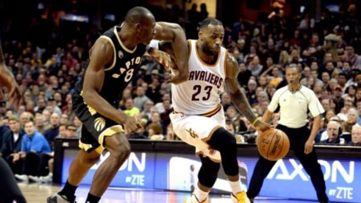 Jan 4, 2016; Cleveland, OH, USA; Cleveland Cavaliers forward LeBron James (23) drives on Toronto Raptors center Bismack Biyombo (8) during the third quarter at Quicken Loans Arena. The Cavs won 122-100. Mandatory Credit: Ken Blaze-USA TODAY Sports